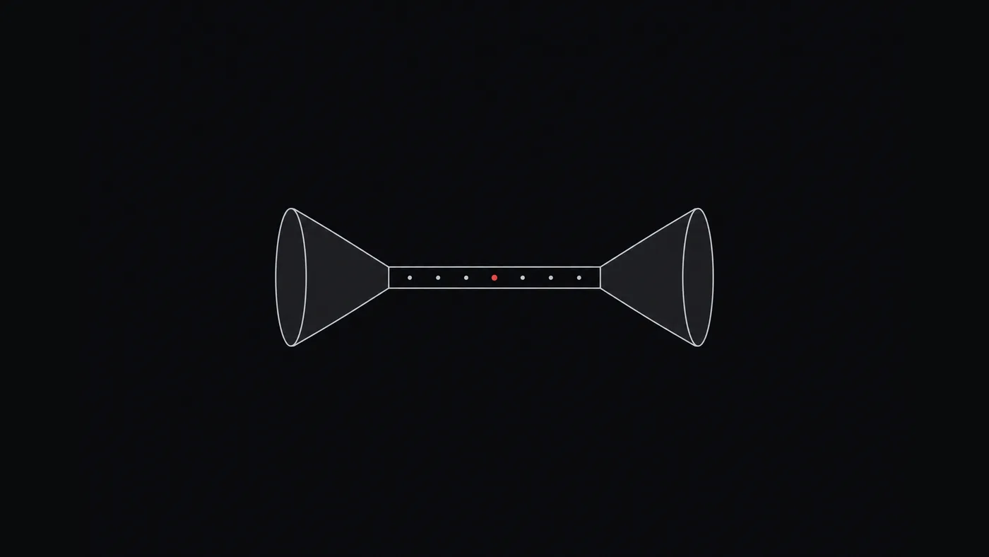 Dois funis opostos ligados por um tubo estreito, com pontos que o atravessam e um ponto vermelho no meio.